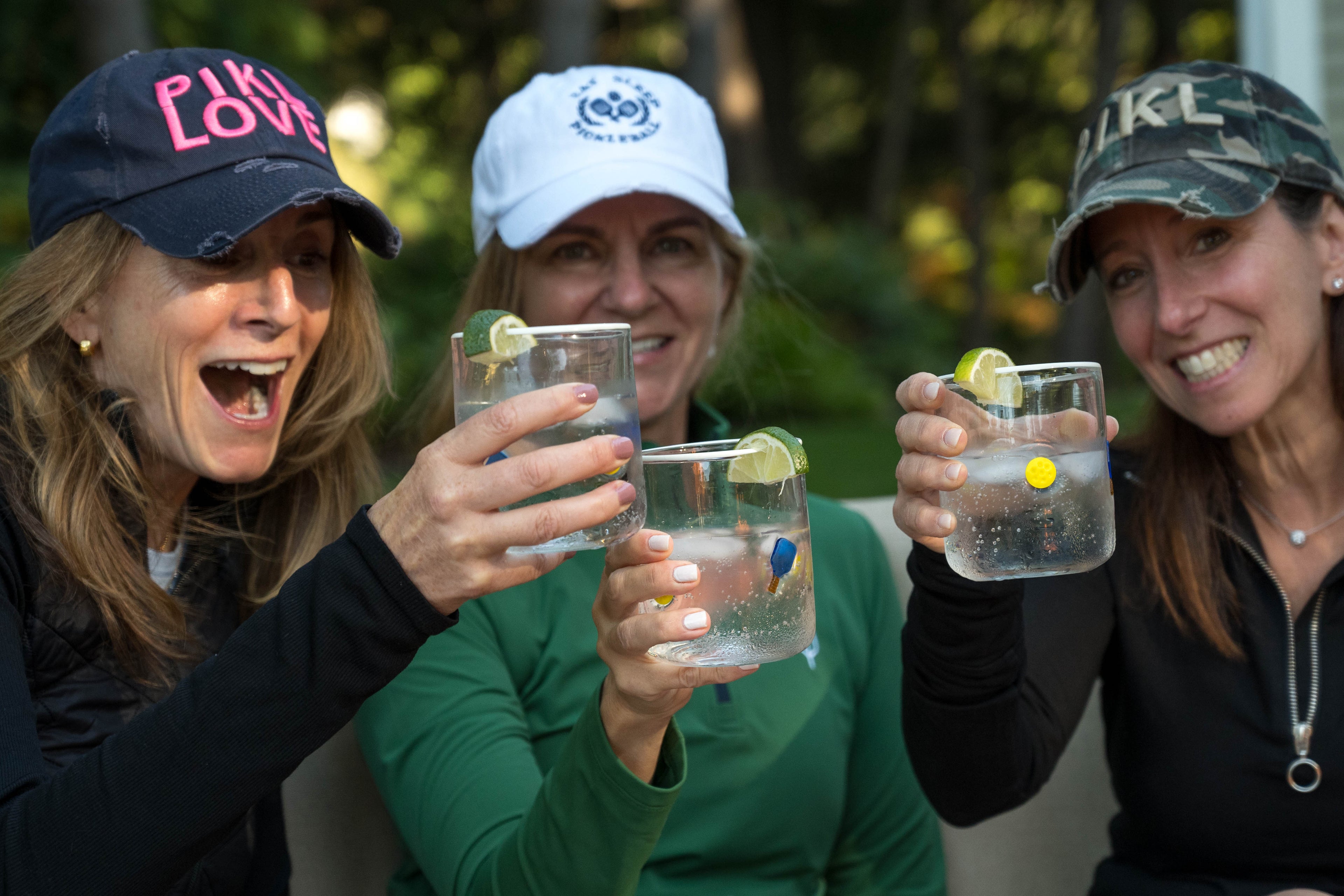 Pickleball hats. 3 female pickleball players happy after playing pickleball.